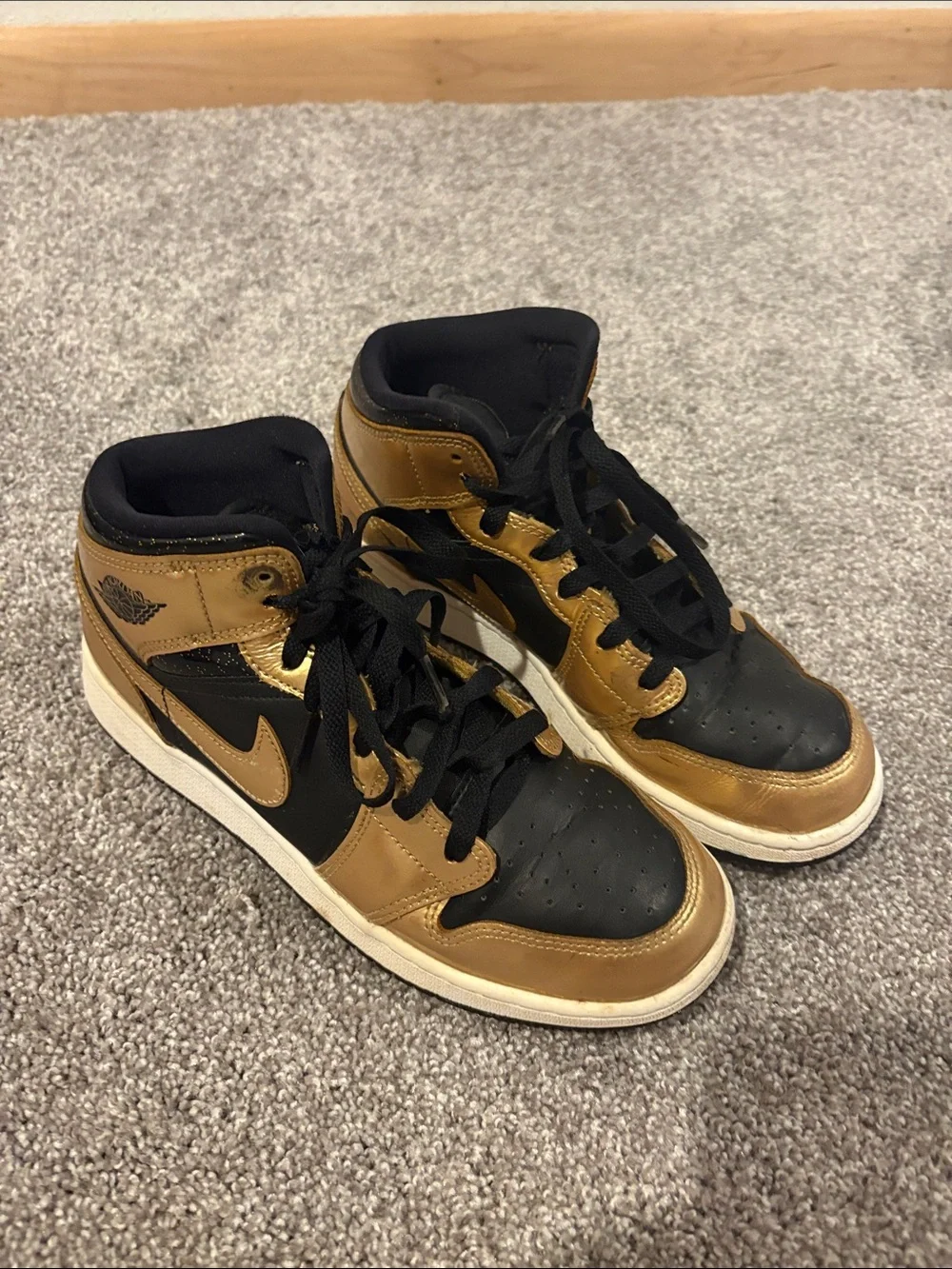 Nike Mid-Top Sneakers in Black and Gold